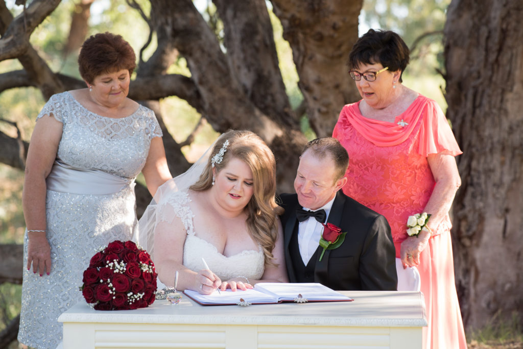 bride signs the wedding register