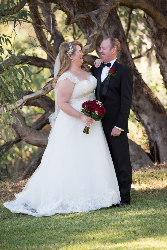 bride and groom laughing together at Mulberry Estate