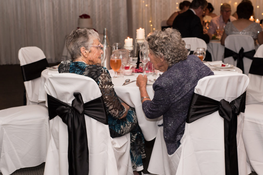 Elderly ladies chatting during wedding reception