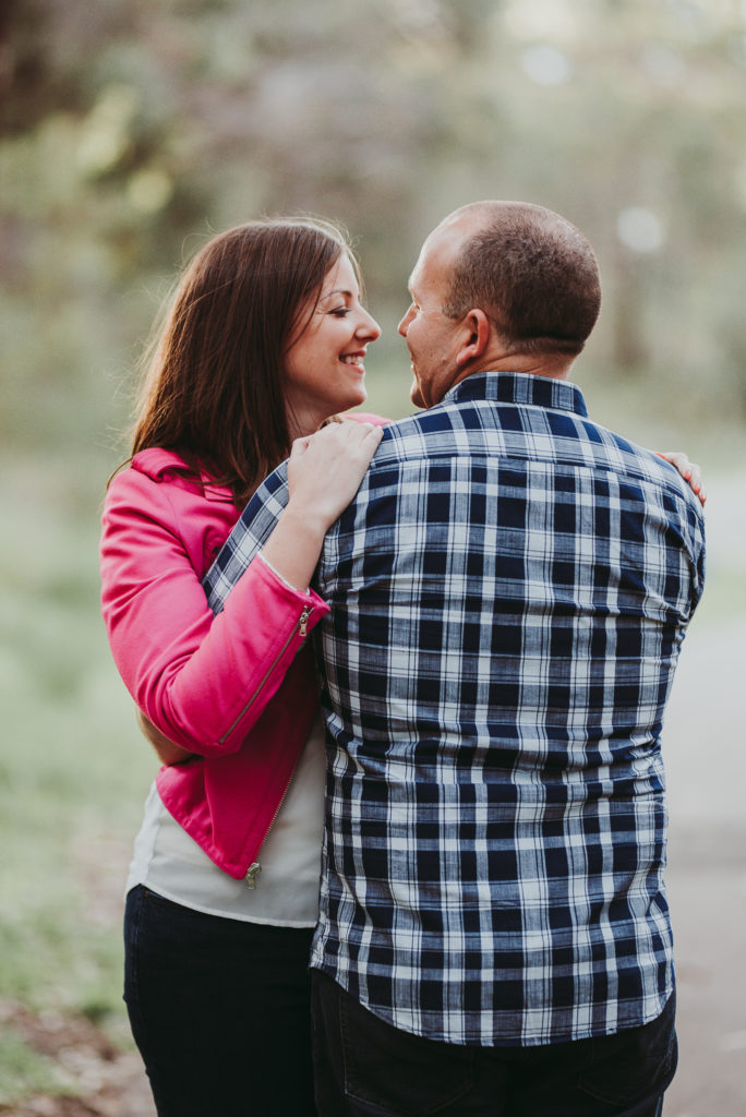 couple cuddling and smiling