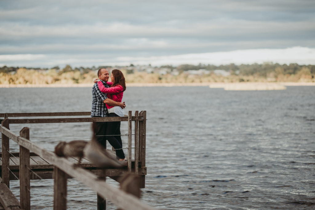 Engaged couple overlooking Lake Joondalup