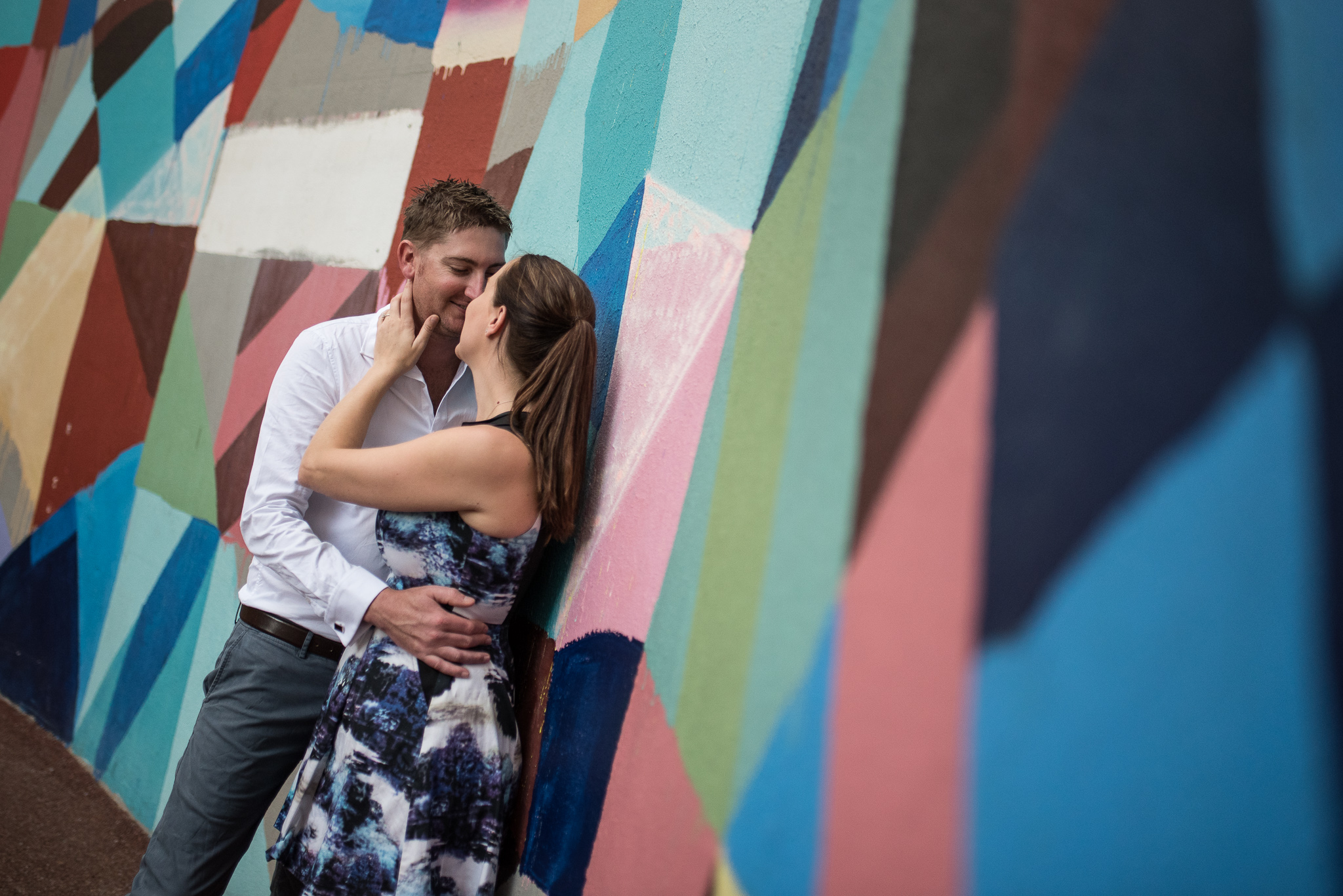 Engagement shoot at Wolf Lane with Maya Hayuk mural behind