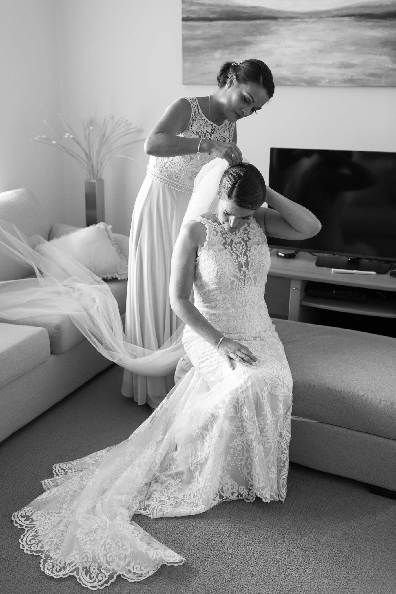 bride's veil is placed on her hair