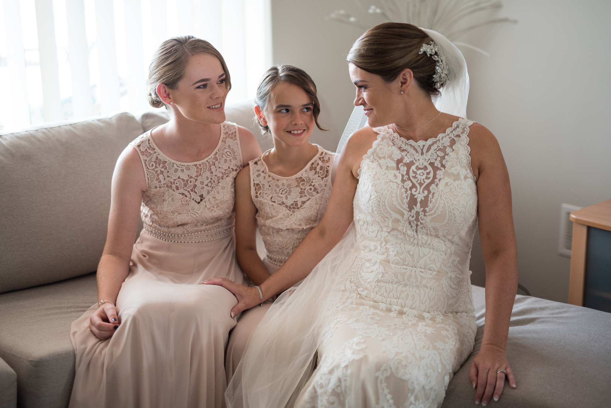 bride and her daughters on her couch