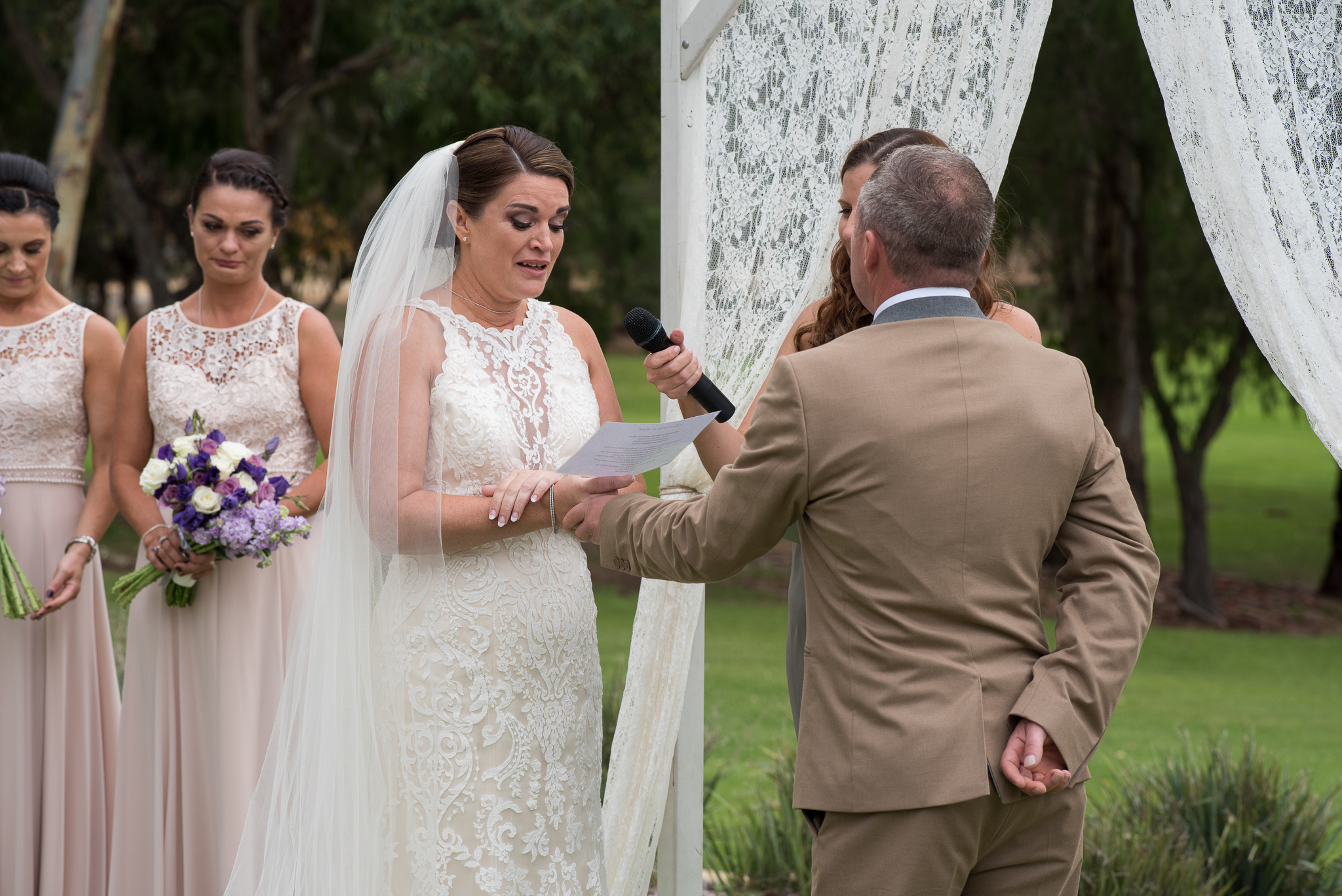 bride overcome with emotion reading her vows