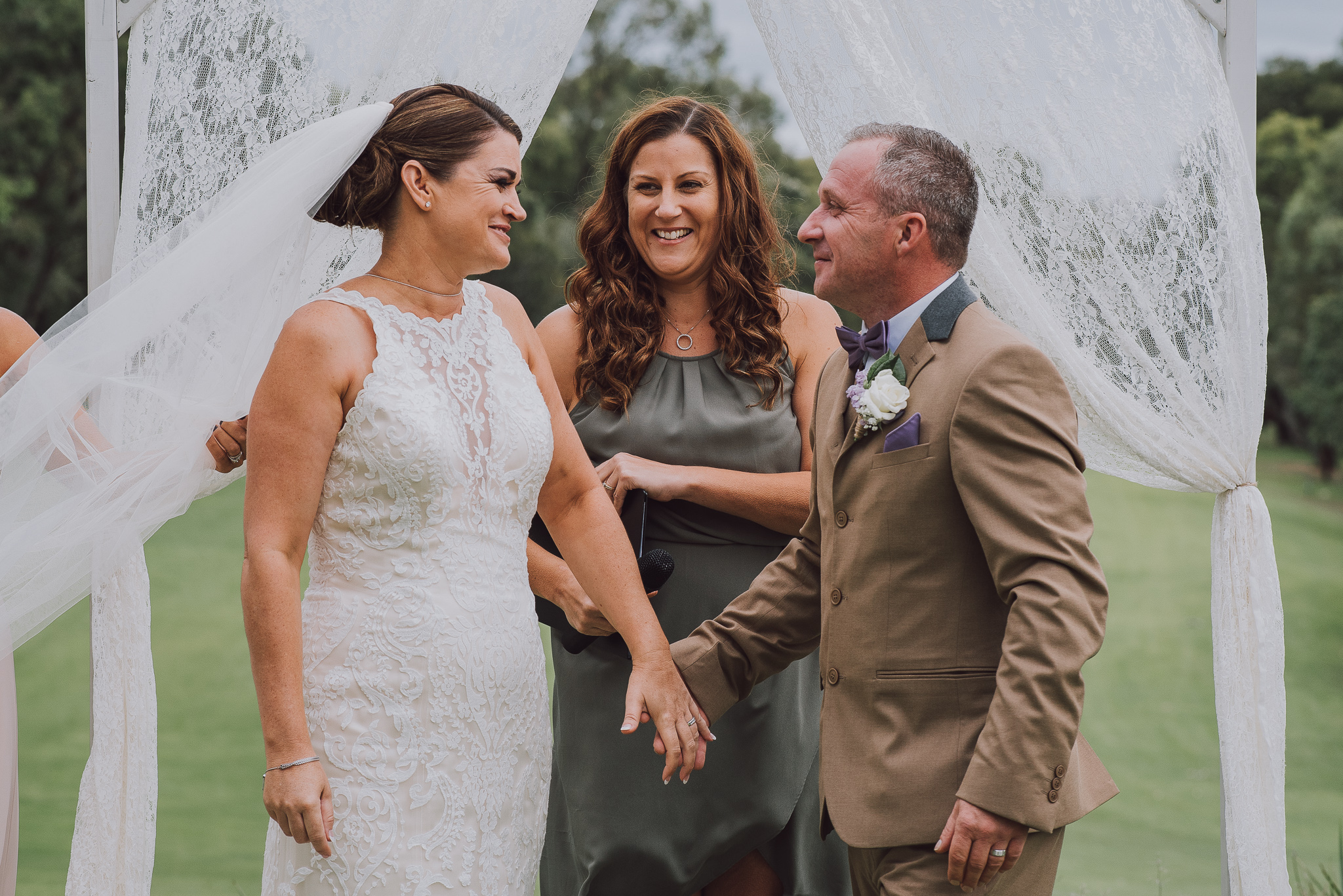 bride and groom smile at each other after being announced