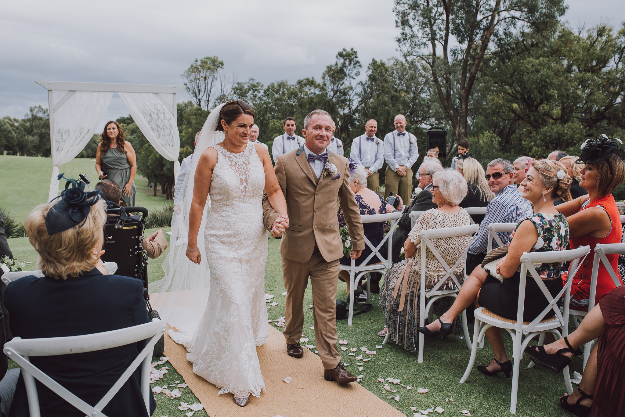 bride and groom walk back down the aisle