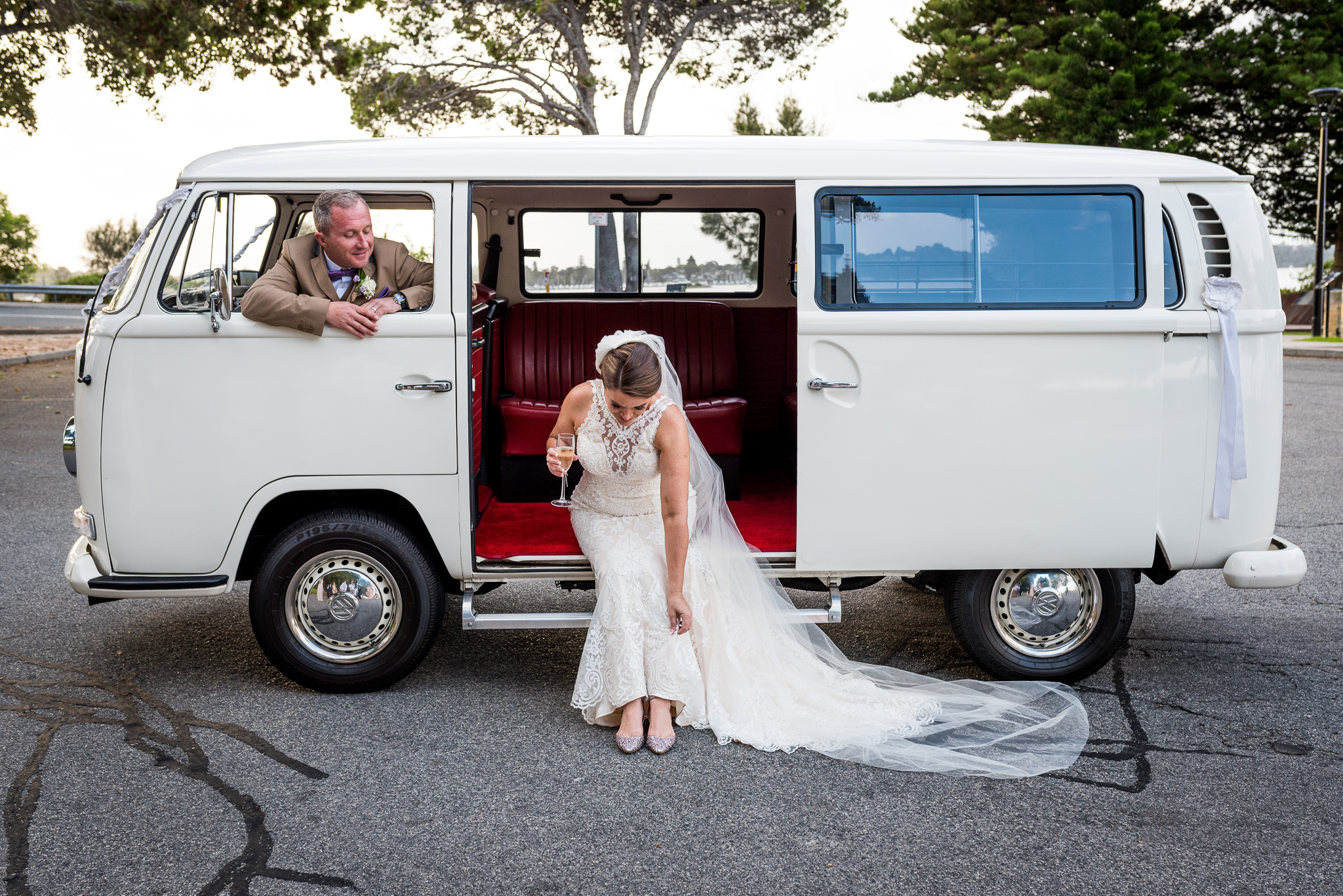 bride looks down at her Jimmy Choos in a vintage kombi