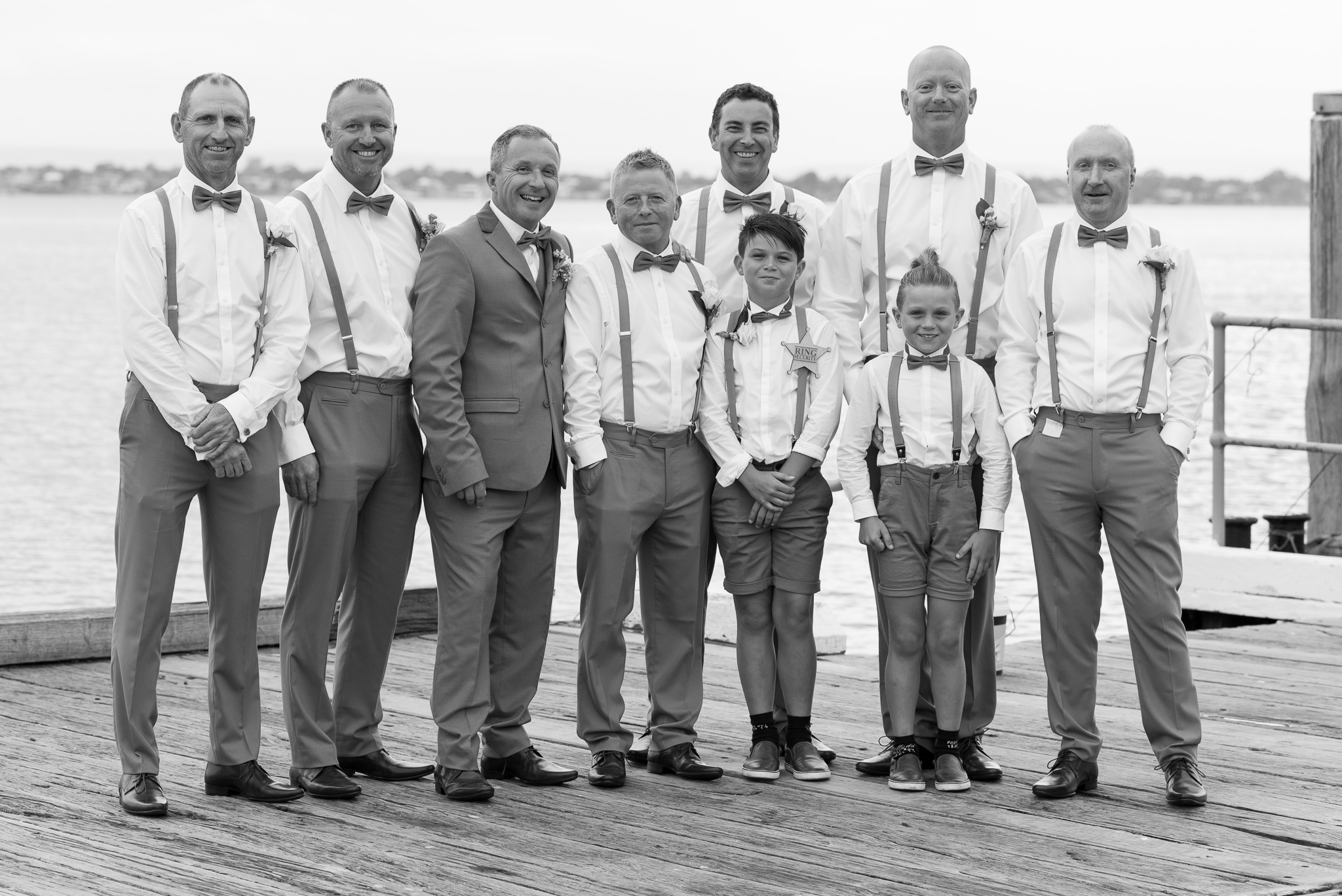 black and white group shot of groom and all the boys