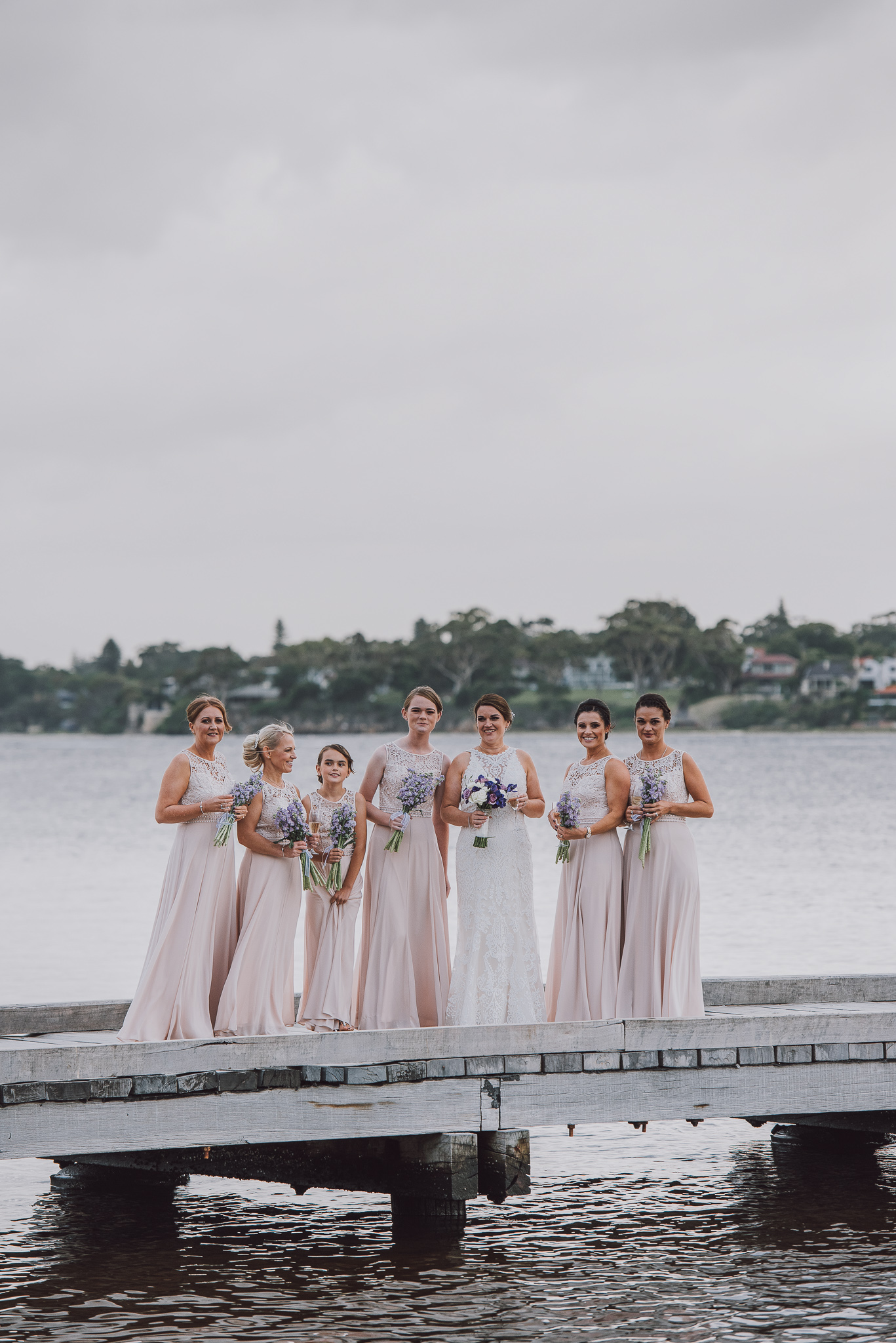 bride and bridesmaids and flower girls on the pier at Point Walter