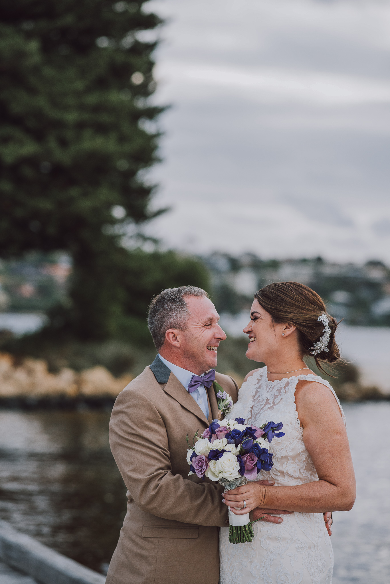 bride and groom looking at each other and smiling