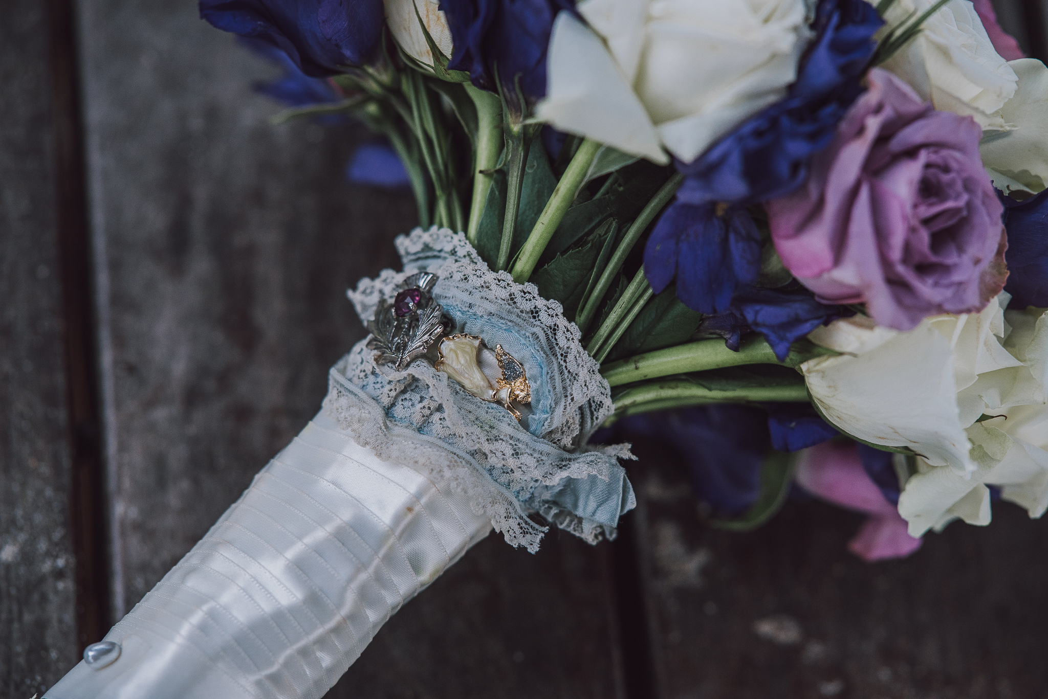 close up of vintage brooch on wedding bouquet