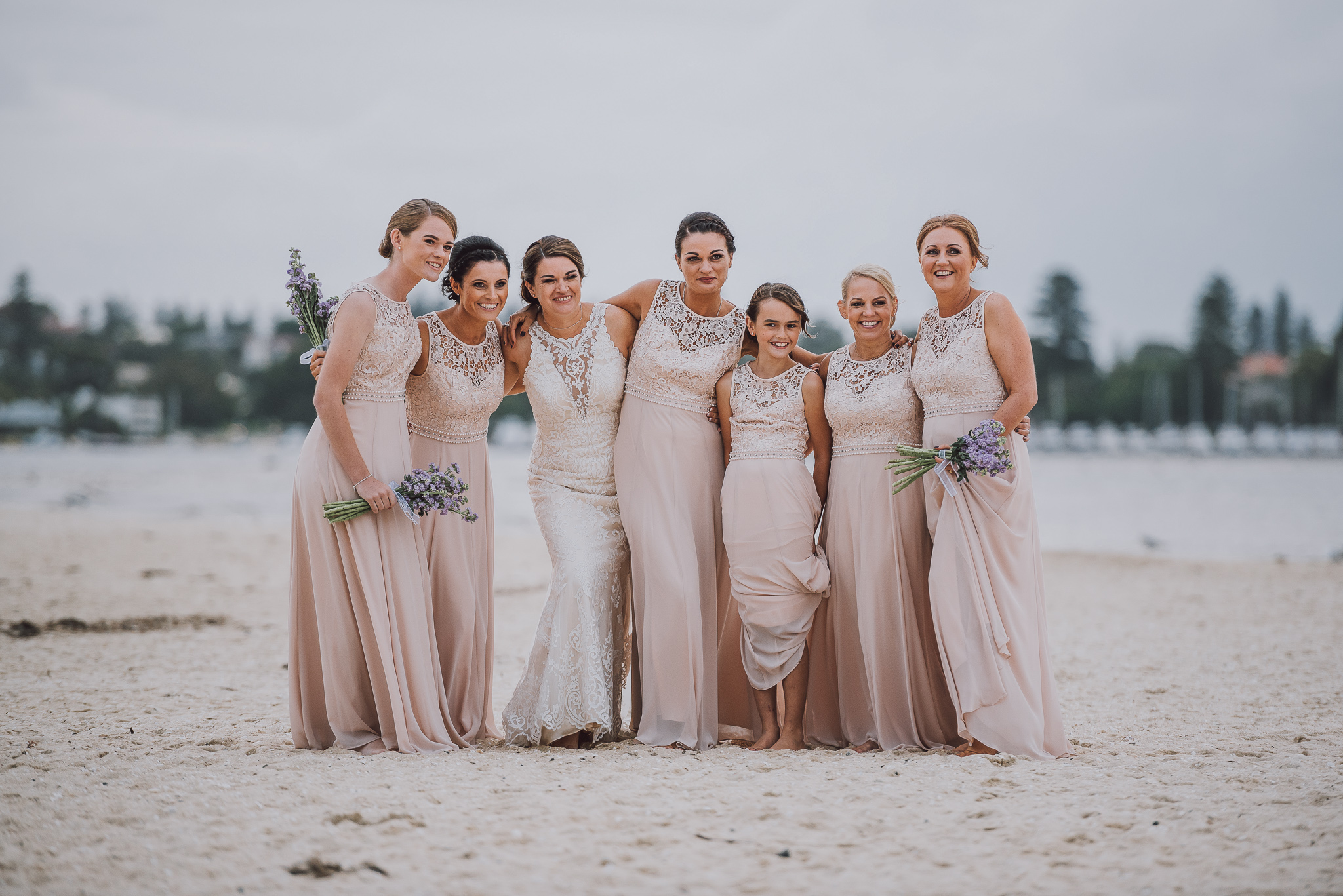 group shot of bride and her ladies on the beach at point walter