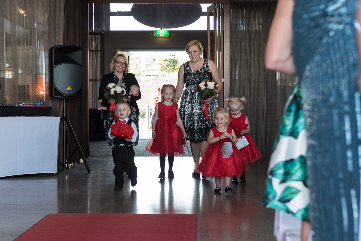 Cute children walking down the aisle at wedding