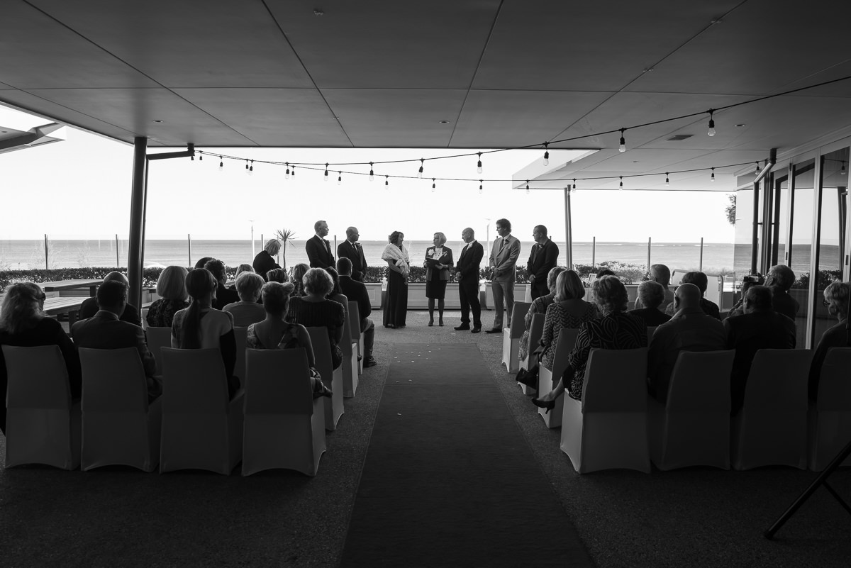 Black and white wide0angle view of wedding at Portofinos restaurant