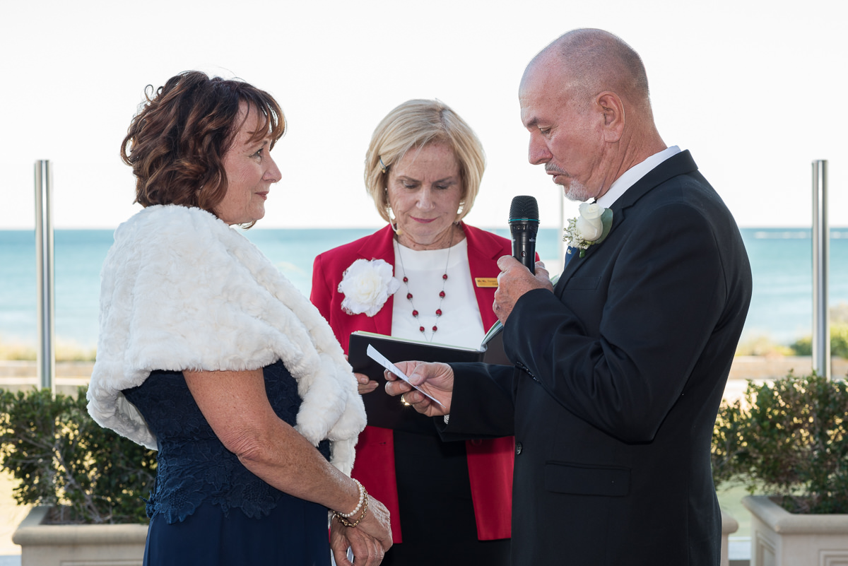 Mature aged groom saying his vows during ceremony at Portofinos