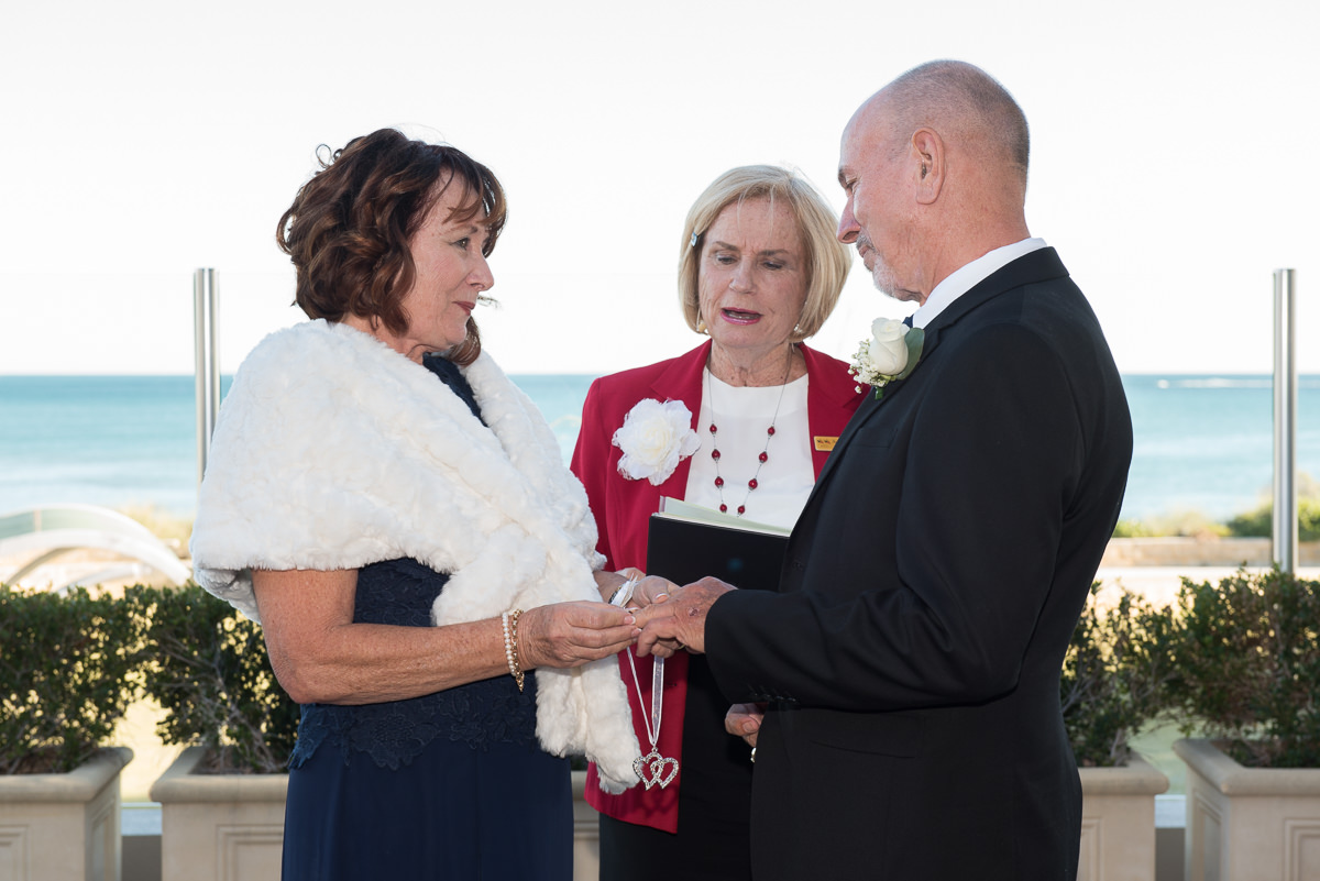 Exchanging rings during ceremony at Portofinos