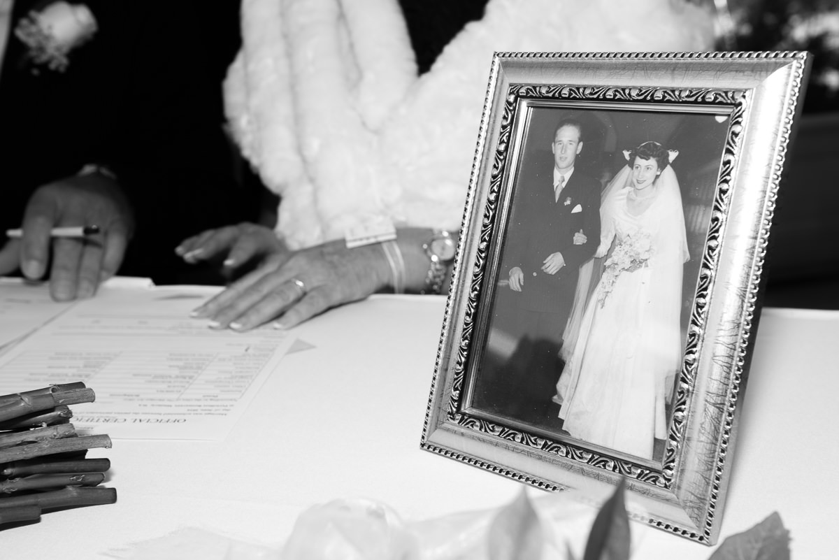 Photo of bride's mum and dad on the signing table