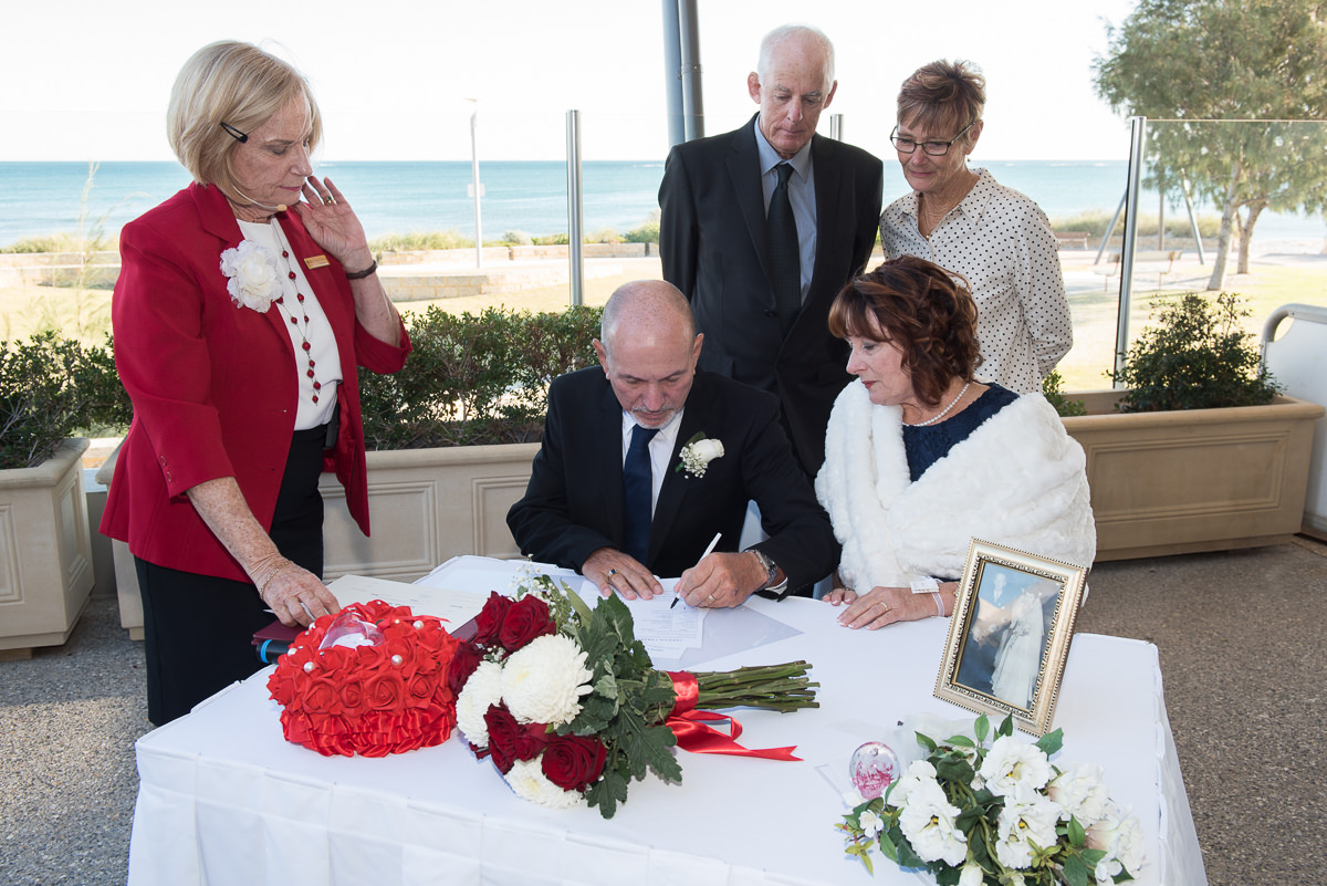 Groom signing the certificate at Portofinos