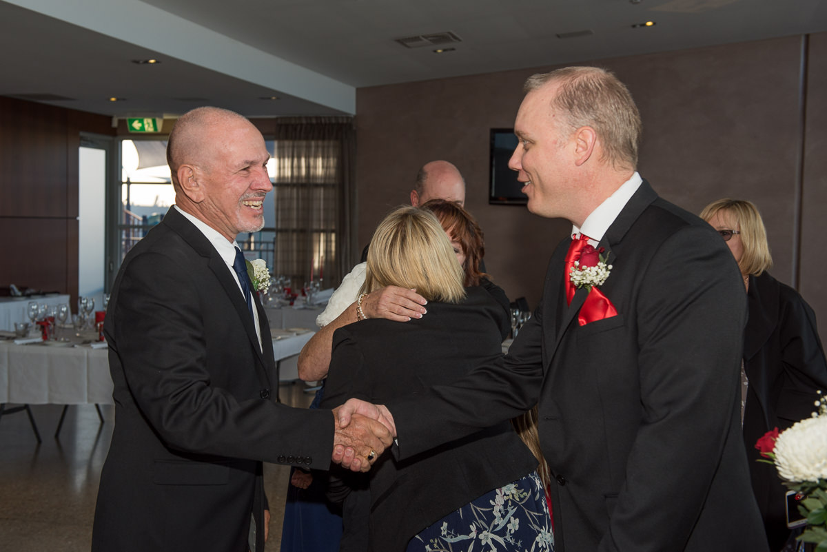 Son congratulating his father on getting married