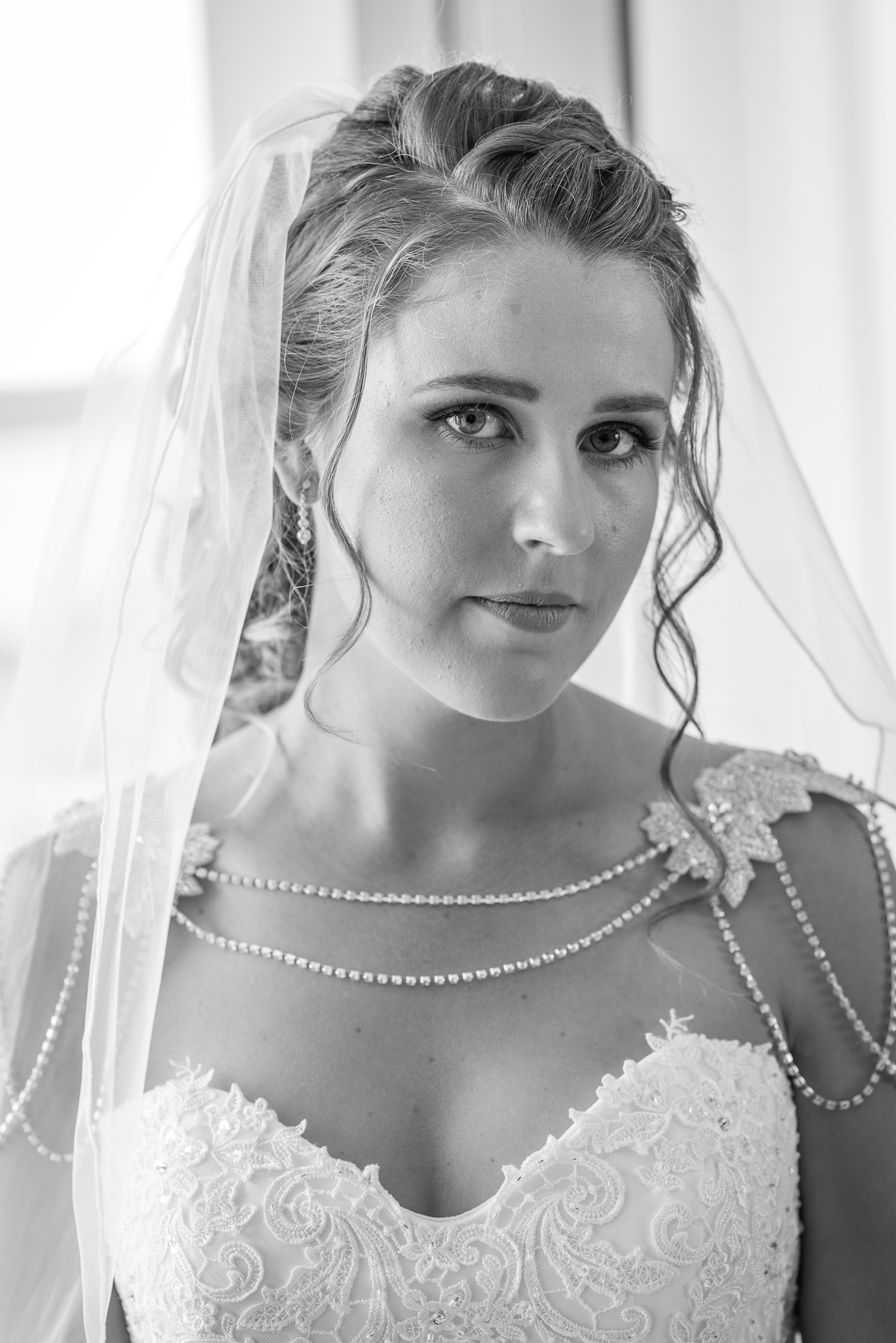 closeup of bride's face with her wedding veil