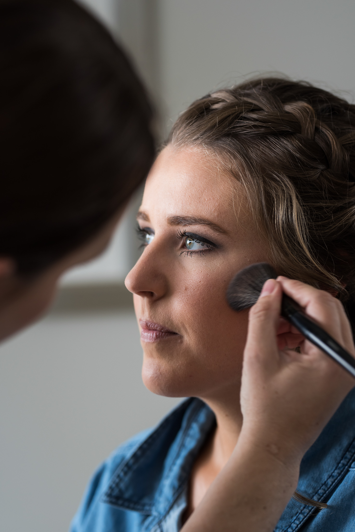 bride having her makeup applied