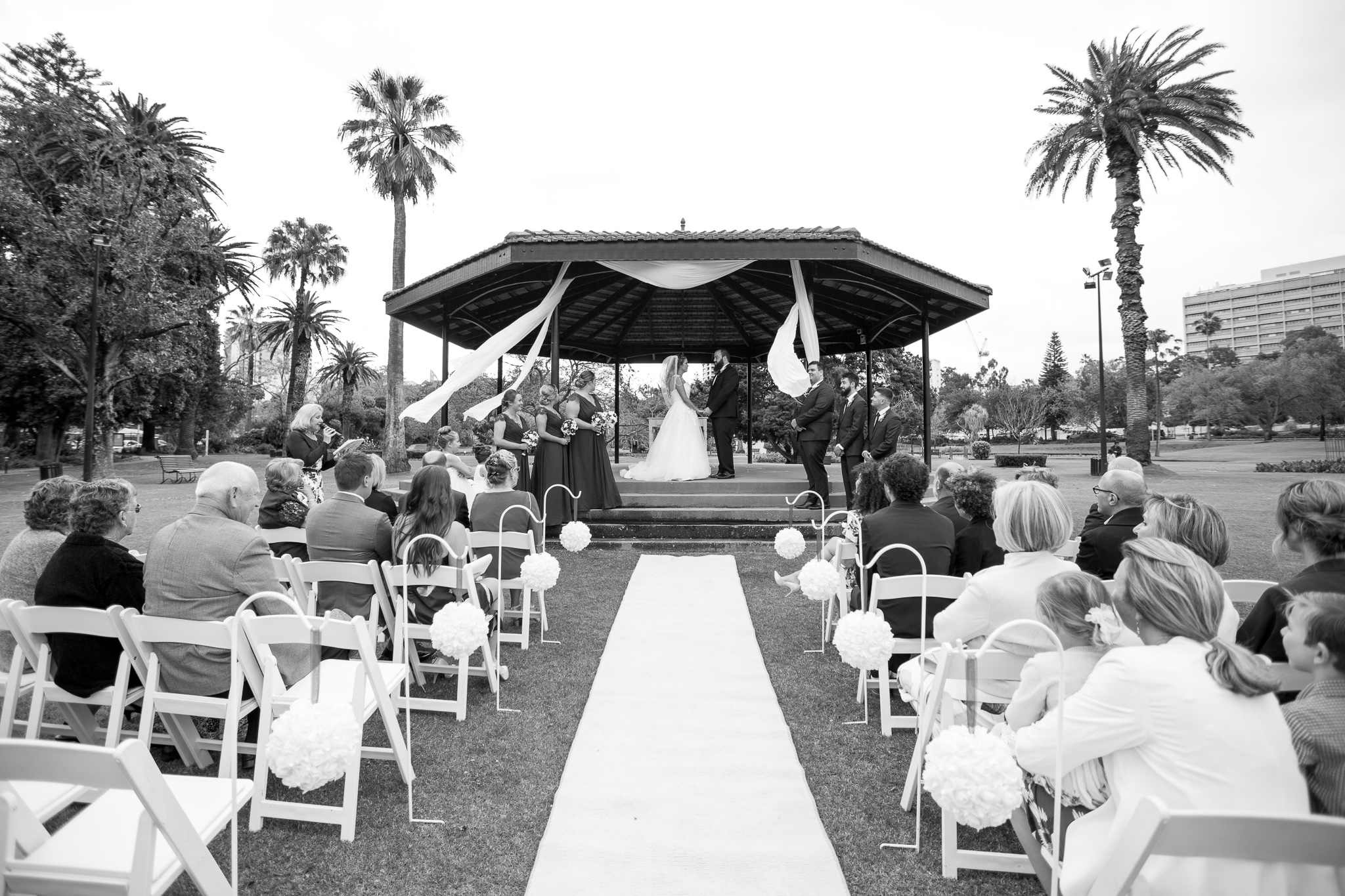 wide shot of wedding in progress at queens gardens