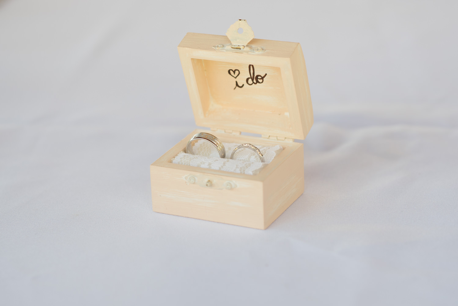 wedding rings in a wooden ring box