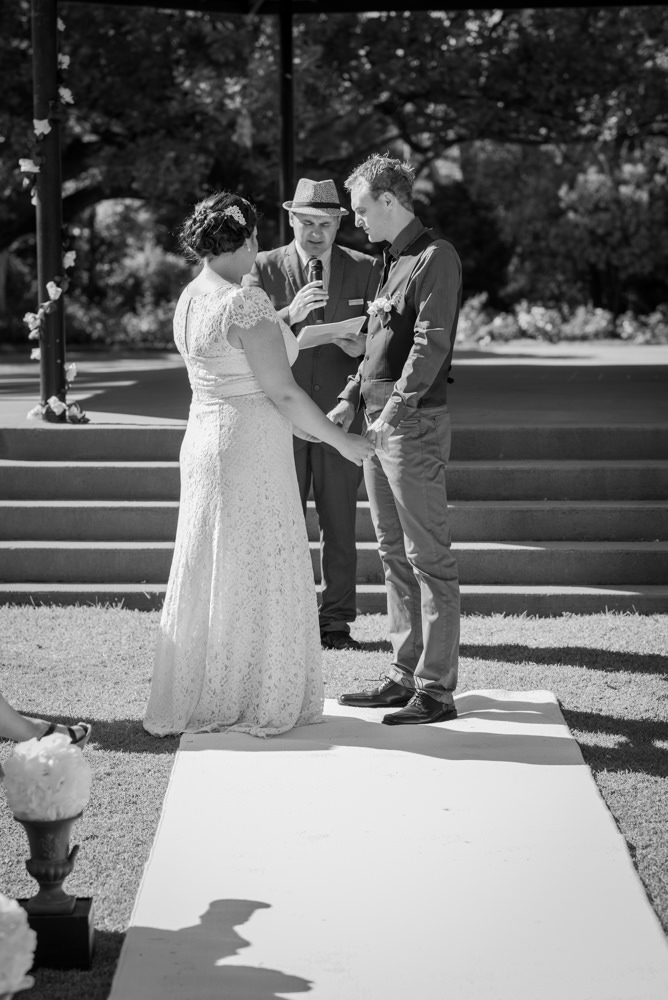 Bride and groom holding hands during ceremony