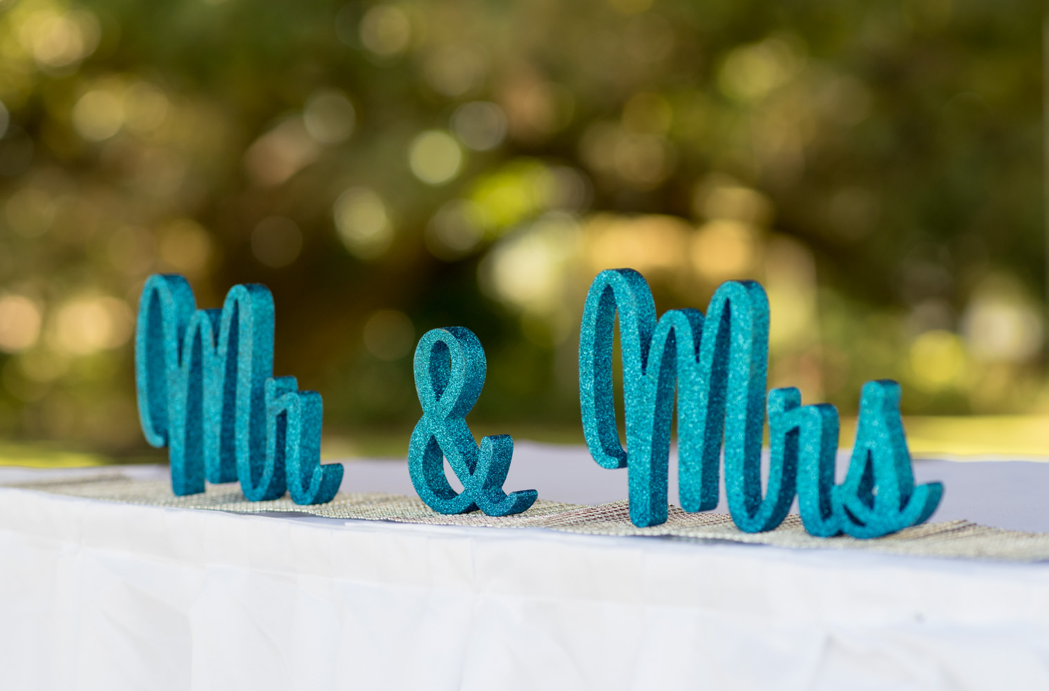 Mr and Mrs sign on the signing table