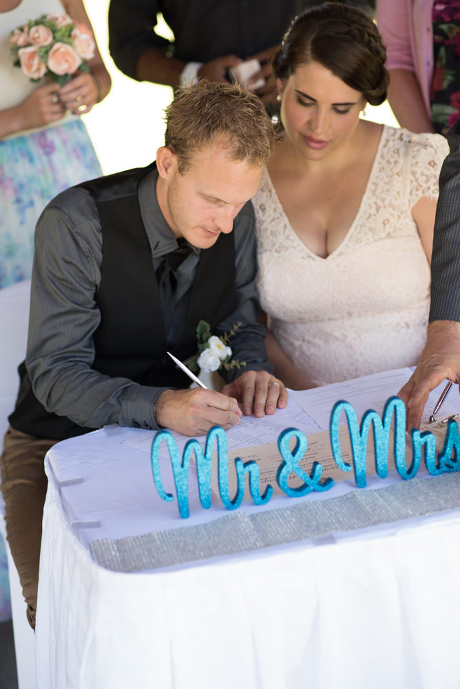 Groom signing the registry