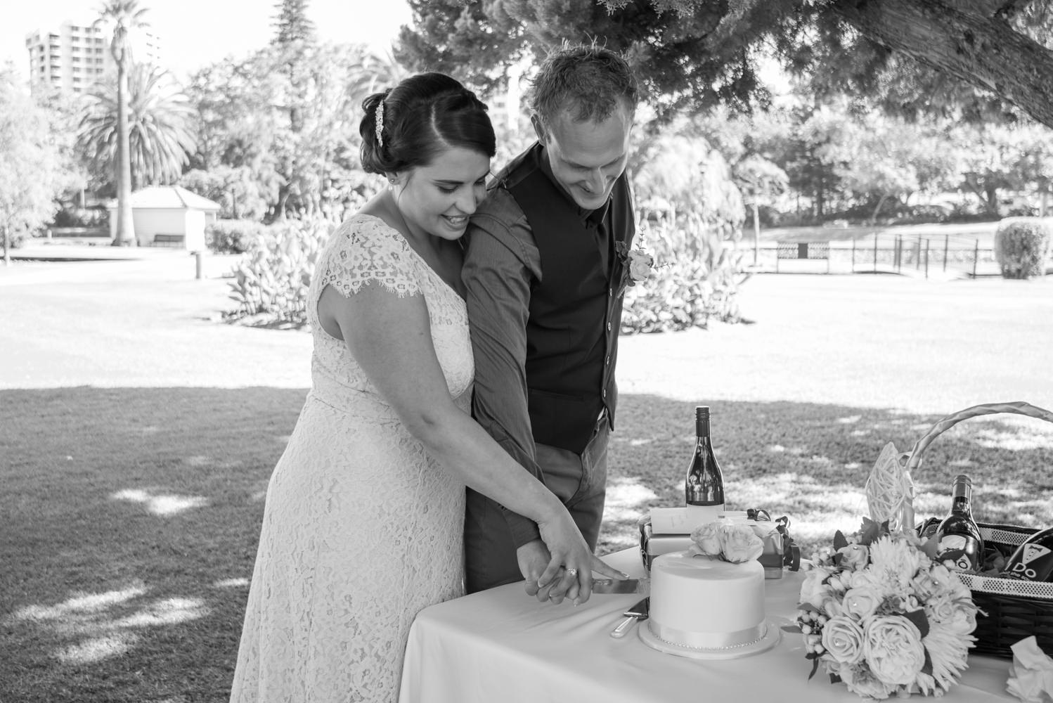 Bride and groom cutting the cake