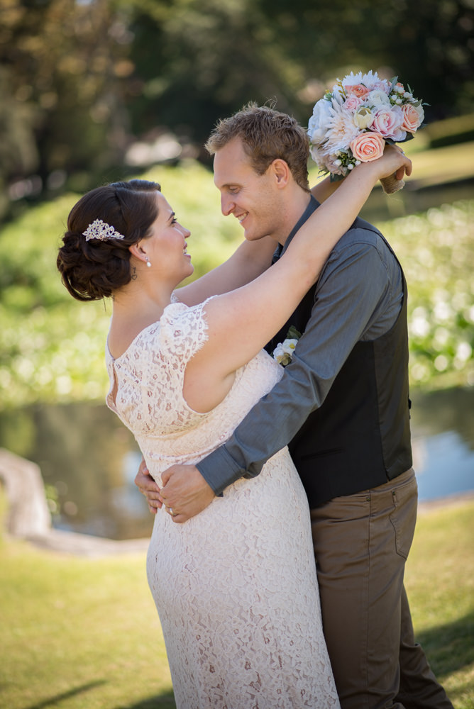 Bride and groom looking at each other and smiling