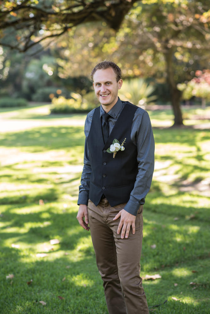 Groom wearing just vest