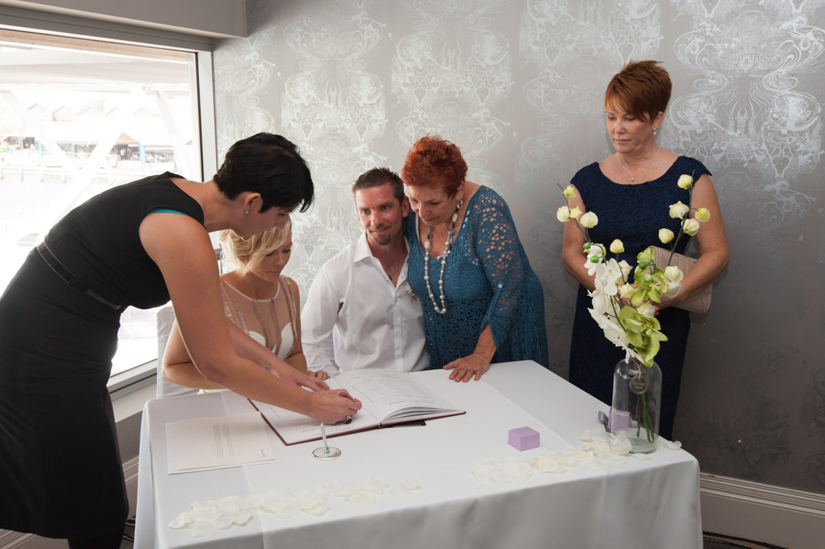 Celebrant shows where to sign