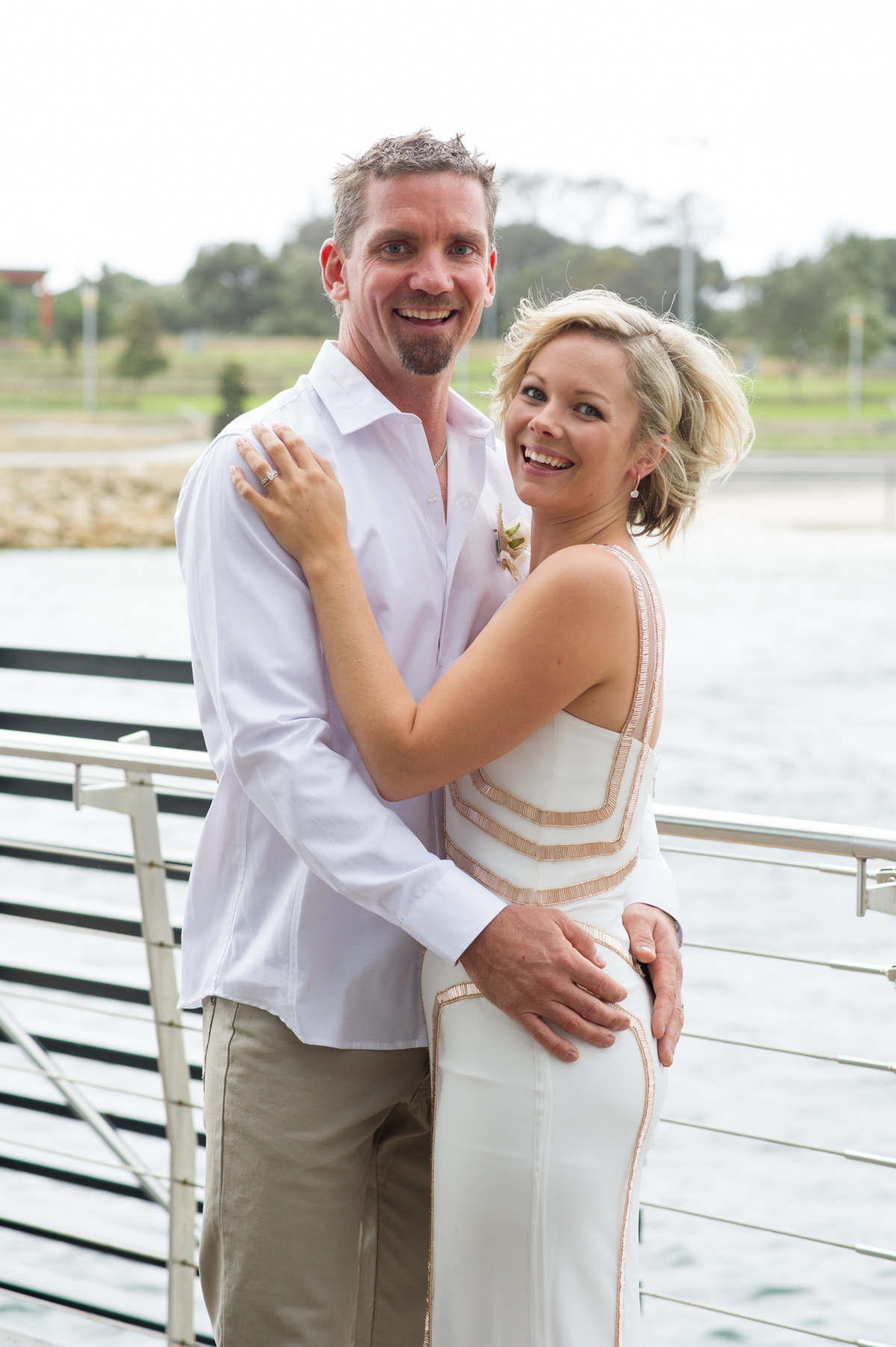 Bride and groom cuddling