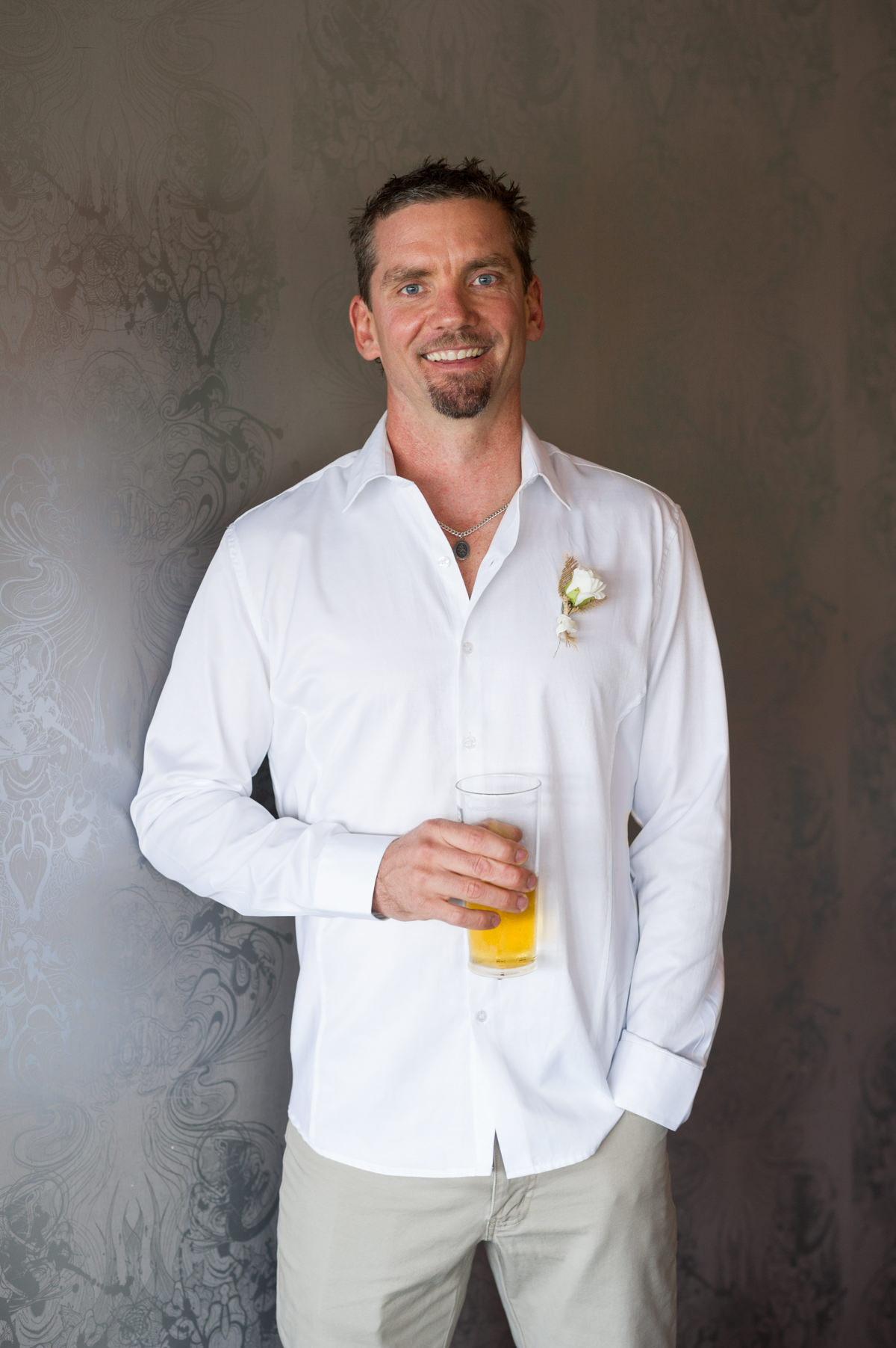 Groom waiting for bride with a beer