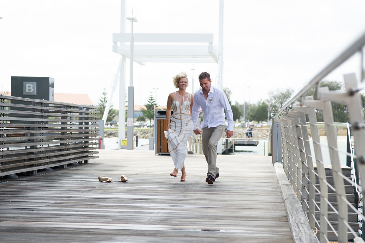 Bride and groom skipping