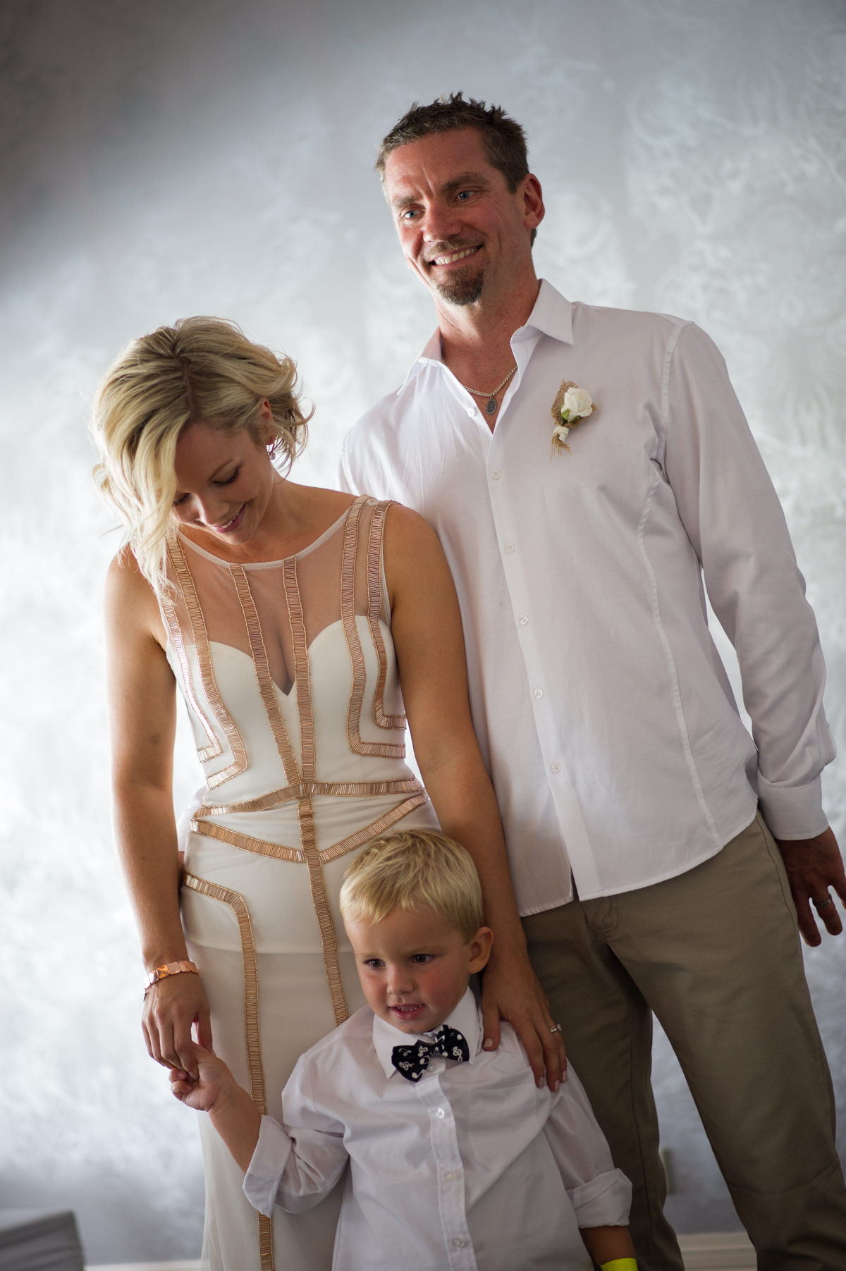 Bride and groom and little boy